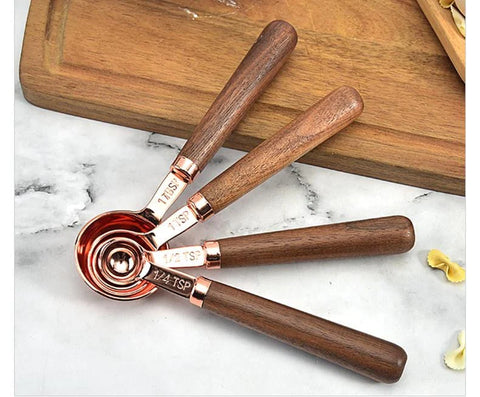 copper measuring cups and spoons