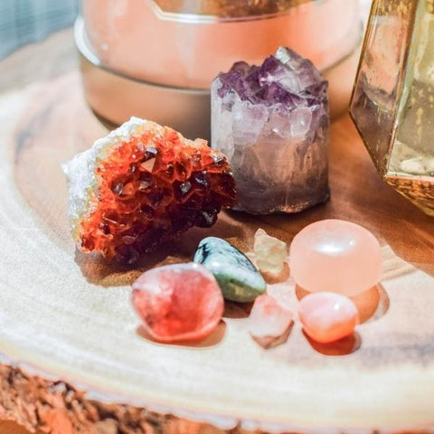 Healing crystals for sleep placed on a wooden nightstand