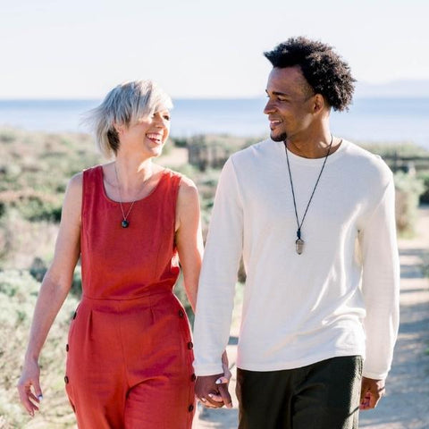 A couple wearing healing stone necklaces - how to use healing crystals