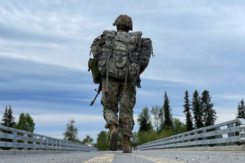 Soldier doing a ruck march with a big pack