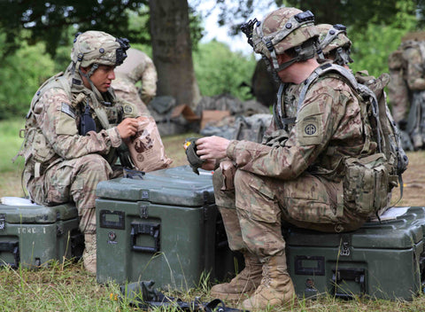 soldiers eating mres in the field