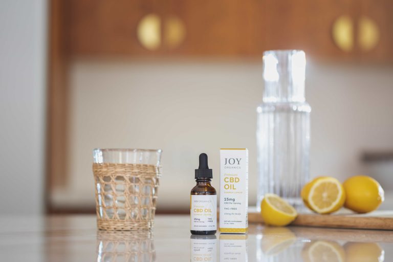 Joy Organics broad spectrum Summer Lemon CBD Oil Tincture on table