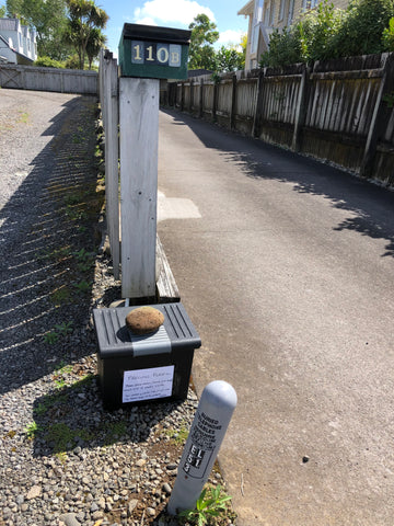 Photo showing small bin to collect plastic, sitting at edge of driveway