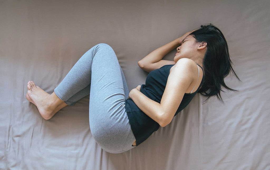 How To Relieve Period Cramps With These 4 Easy Yoga Poses | YourTango