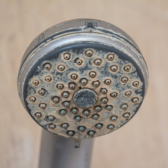 Shower head with hard water residuos