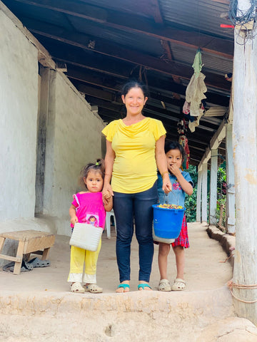 Yessica (mother) and two of her children at her house in Honduras