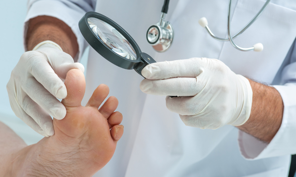 Doctor inspecting foot