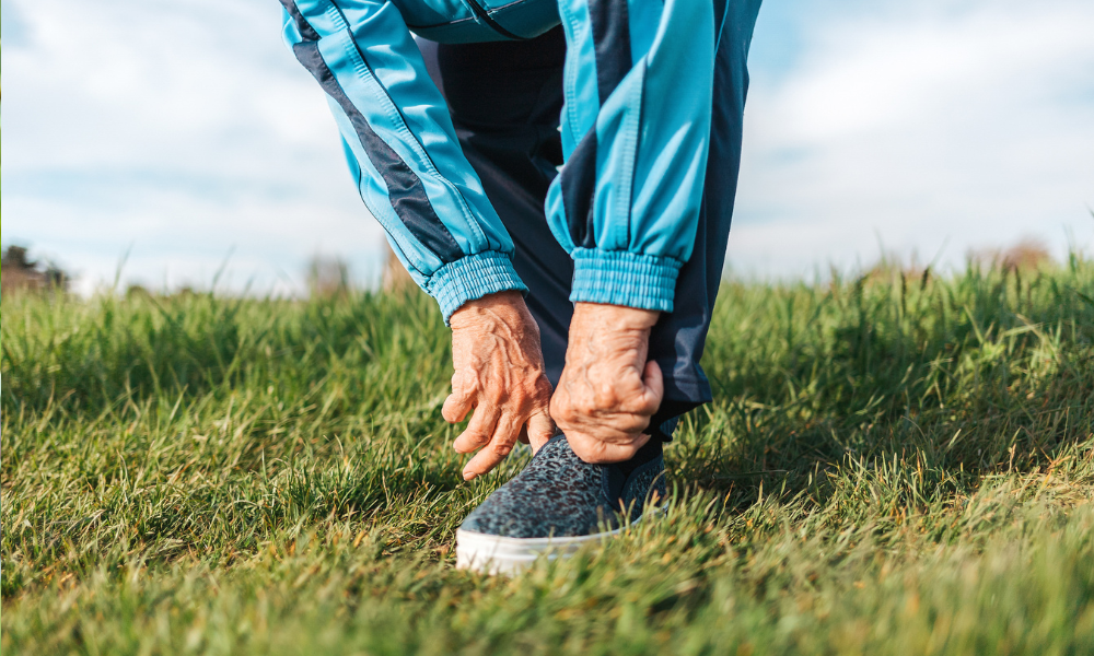 Older lady adjusting shoe