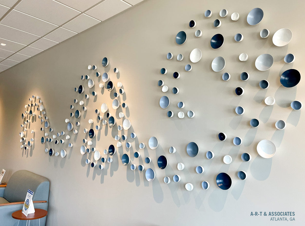 Swirling monochromatic (blues and whites) Wall Play design on wall in Orthodontics office.