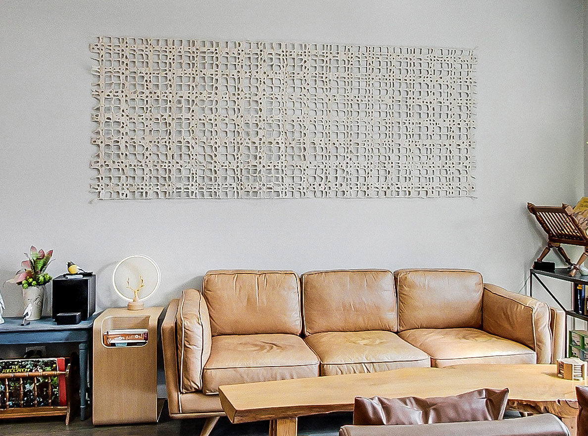 Digital handmade paper panel on a living room wall.