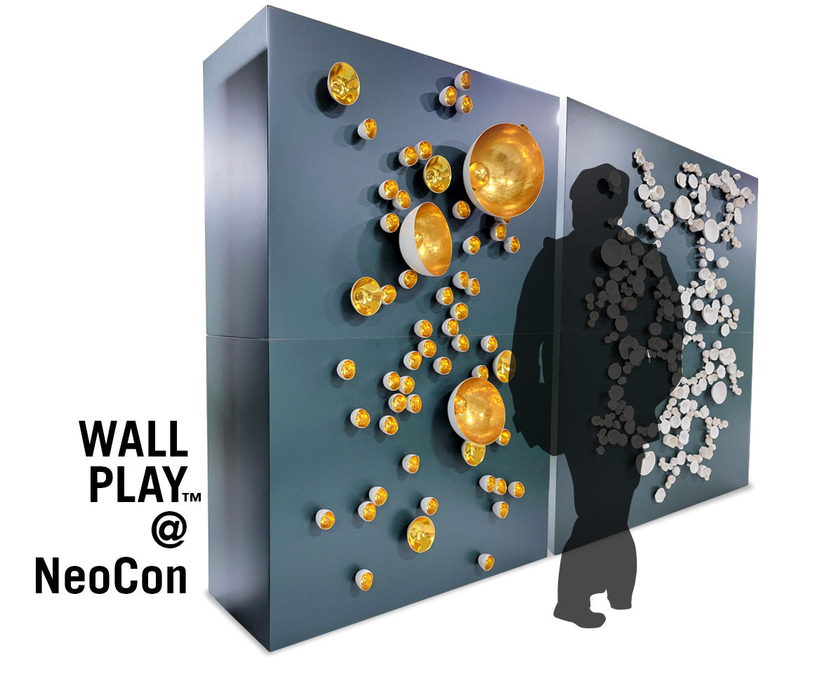 Mock up of person walking past large blue walls with Wall Play™ on it.