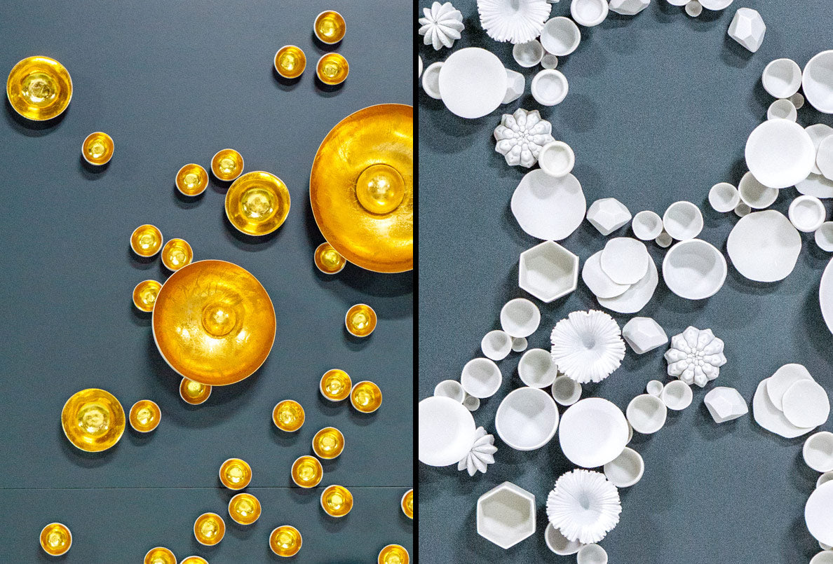 Close ups of wall sculptures on blue background. Left image has gold egg shaped sculptures, right image has white sculptures in variety of shapes.