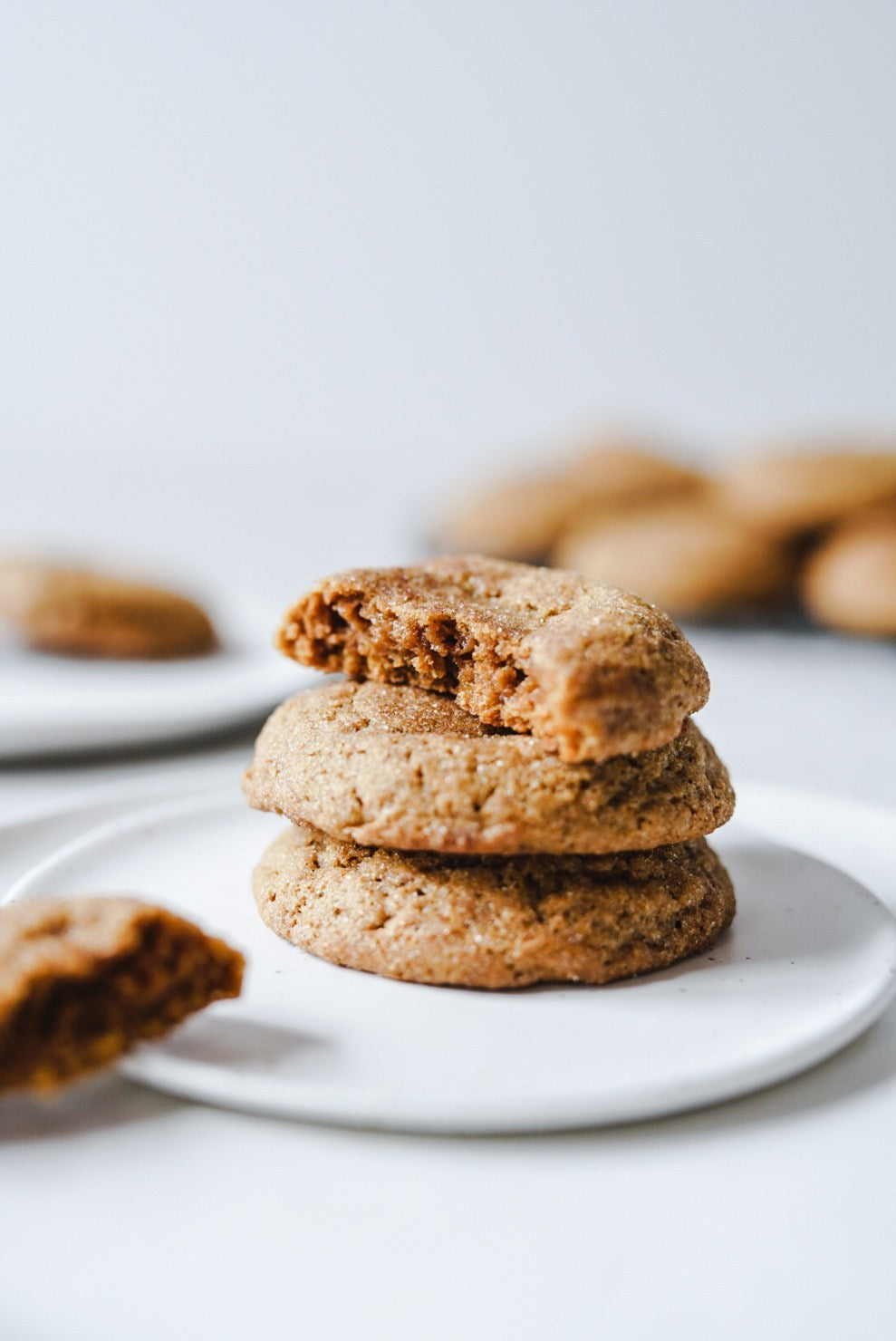 Pumpkin Snickerdoodles freshly baked and stacked on a Winterwares handmade pottery plate