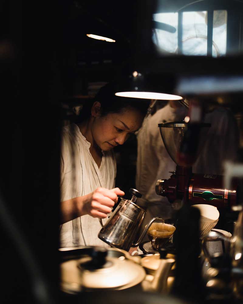 Woman making pour over coffee