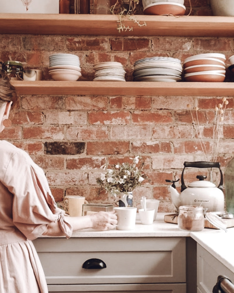 In the kitchen, making tea