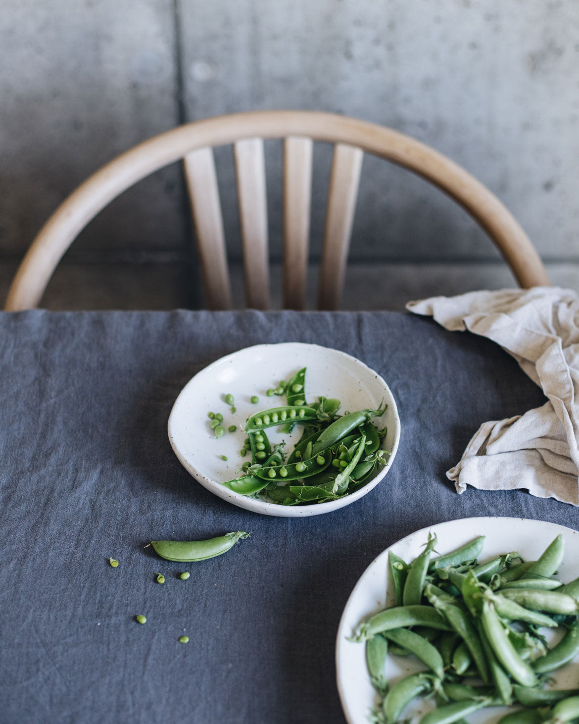 Shelled peas in a stoneware handmade bowl