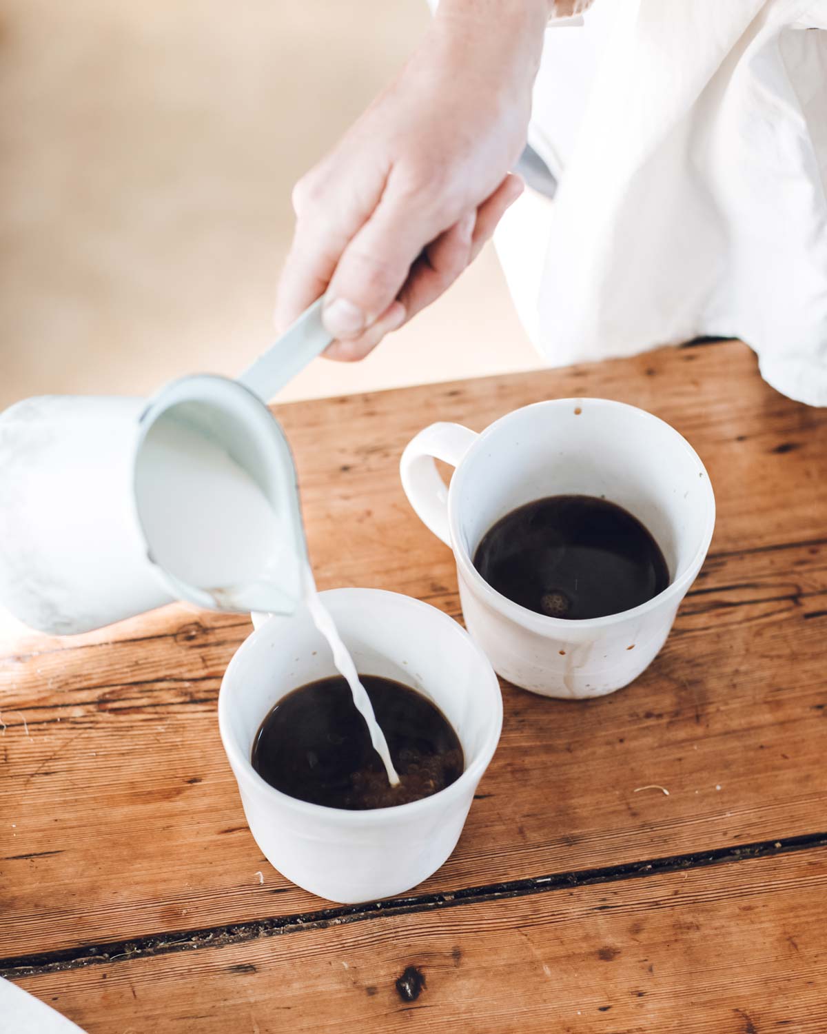 Pouring coffee into Winterwares stoneware mugs