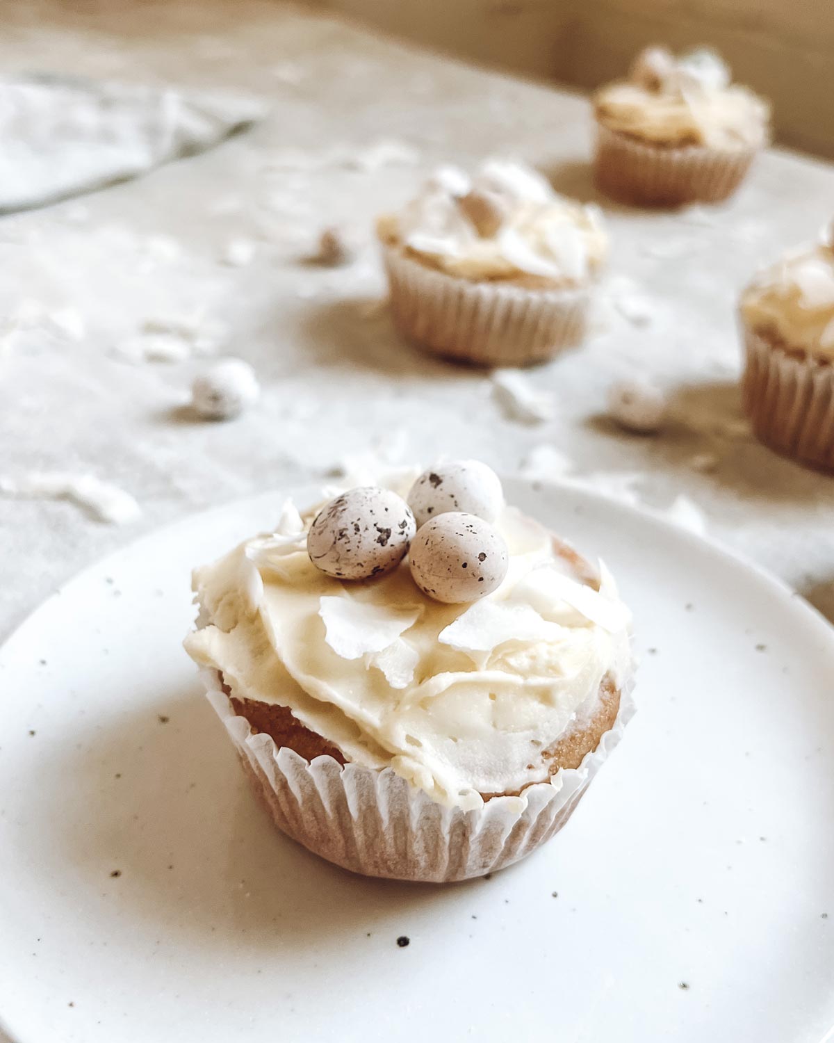 coconut cupcakes on a handmade plate