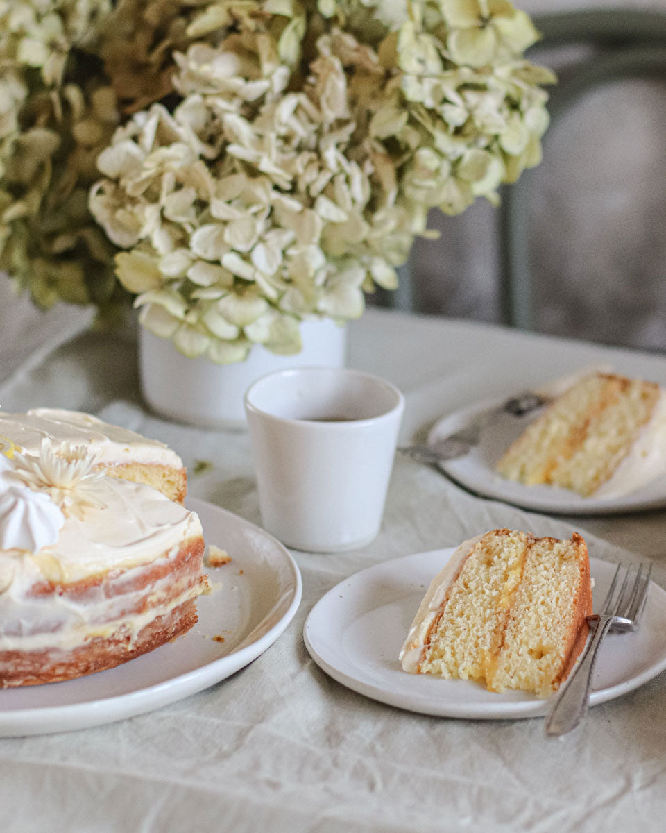 Table set with slices of lemon cake