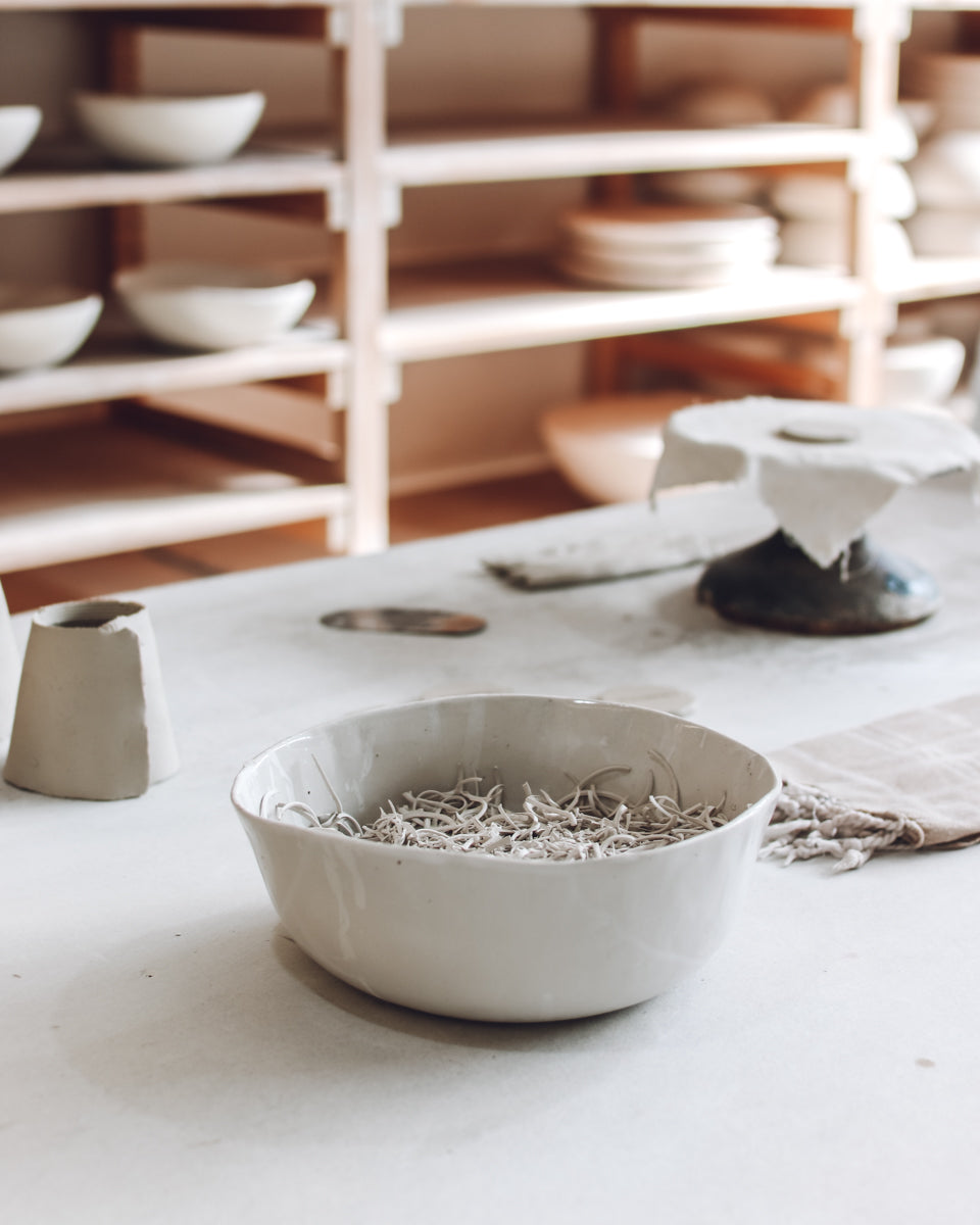 Ceramic bowl filled with clay offcuts