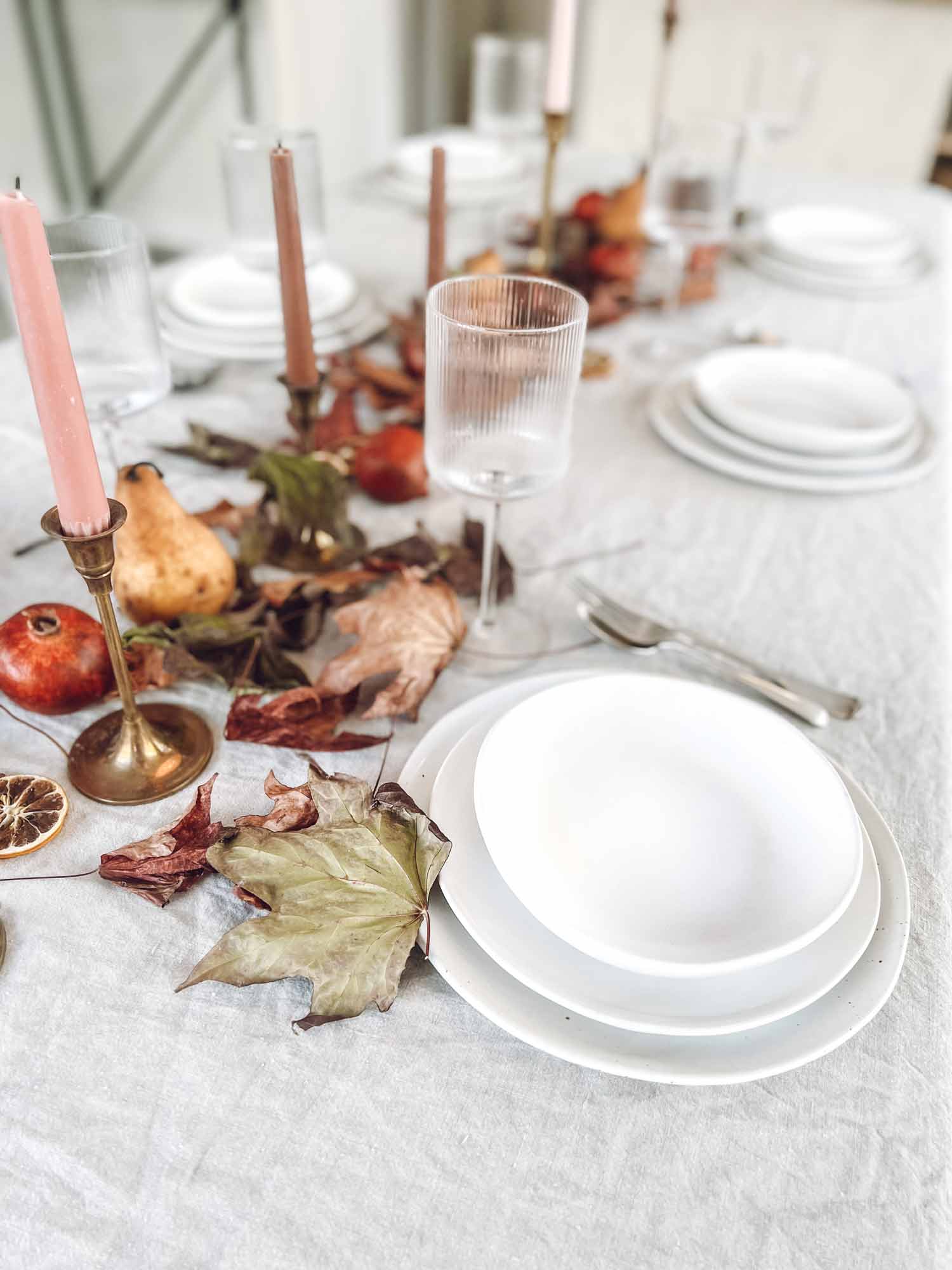 Table style with handmade ceramics and autumn leaves