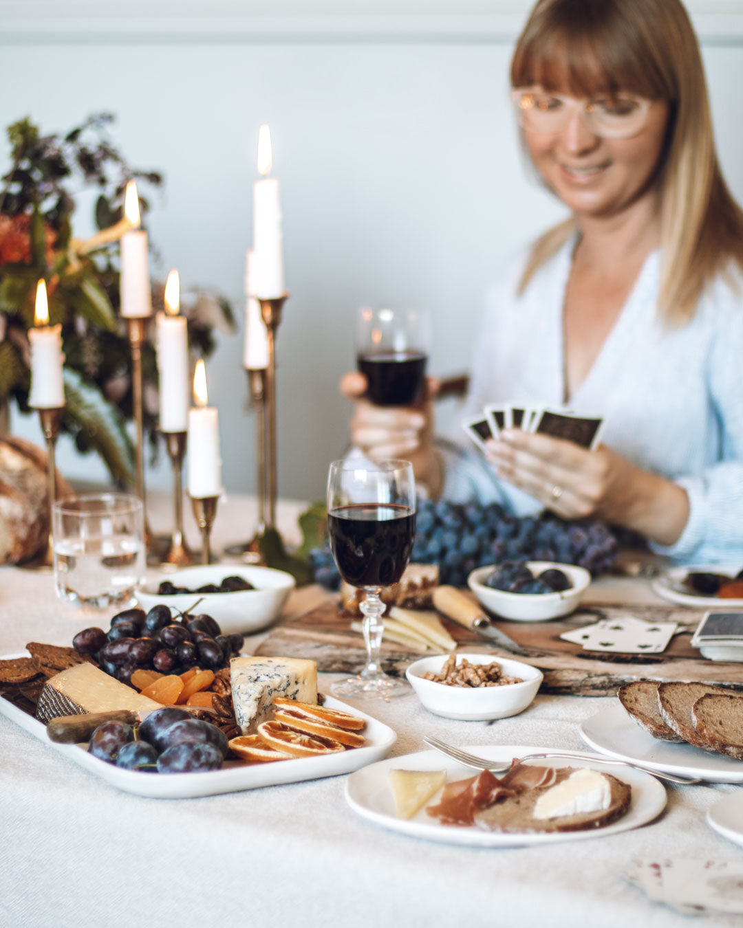 Playing cards at the table laden with autumn fare