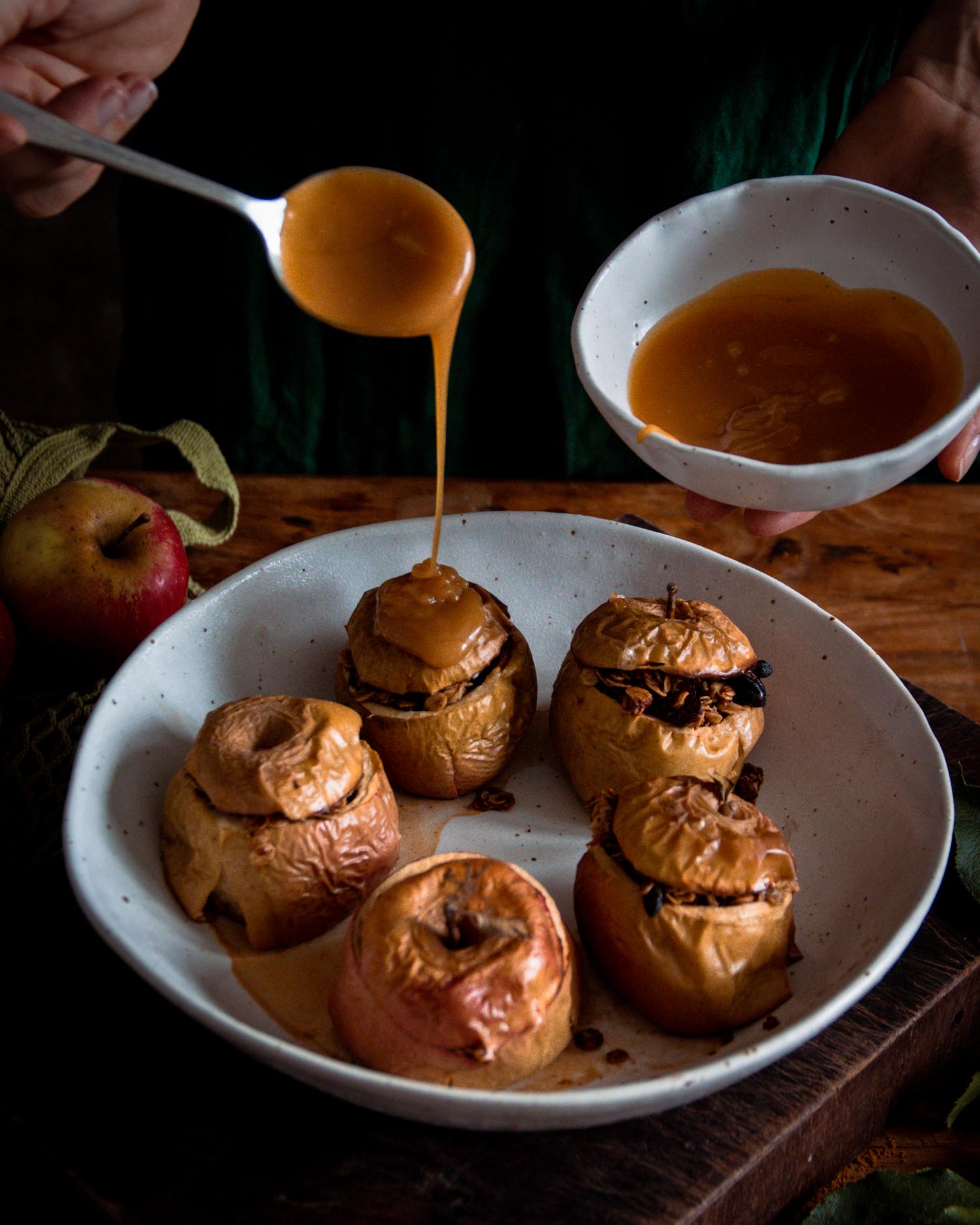 Apples baked in a Winterwares family bowl, with caramel sauce drizzled on top