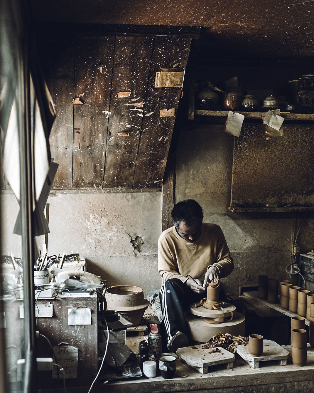 Making pots on a pottery wheel in the Onta pottery village
