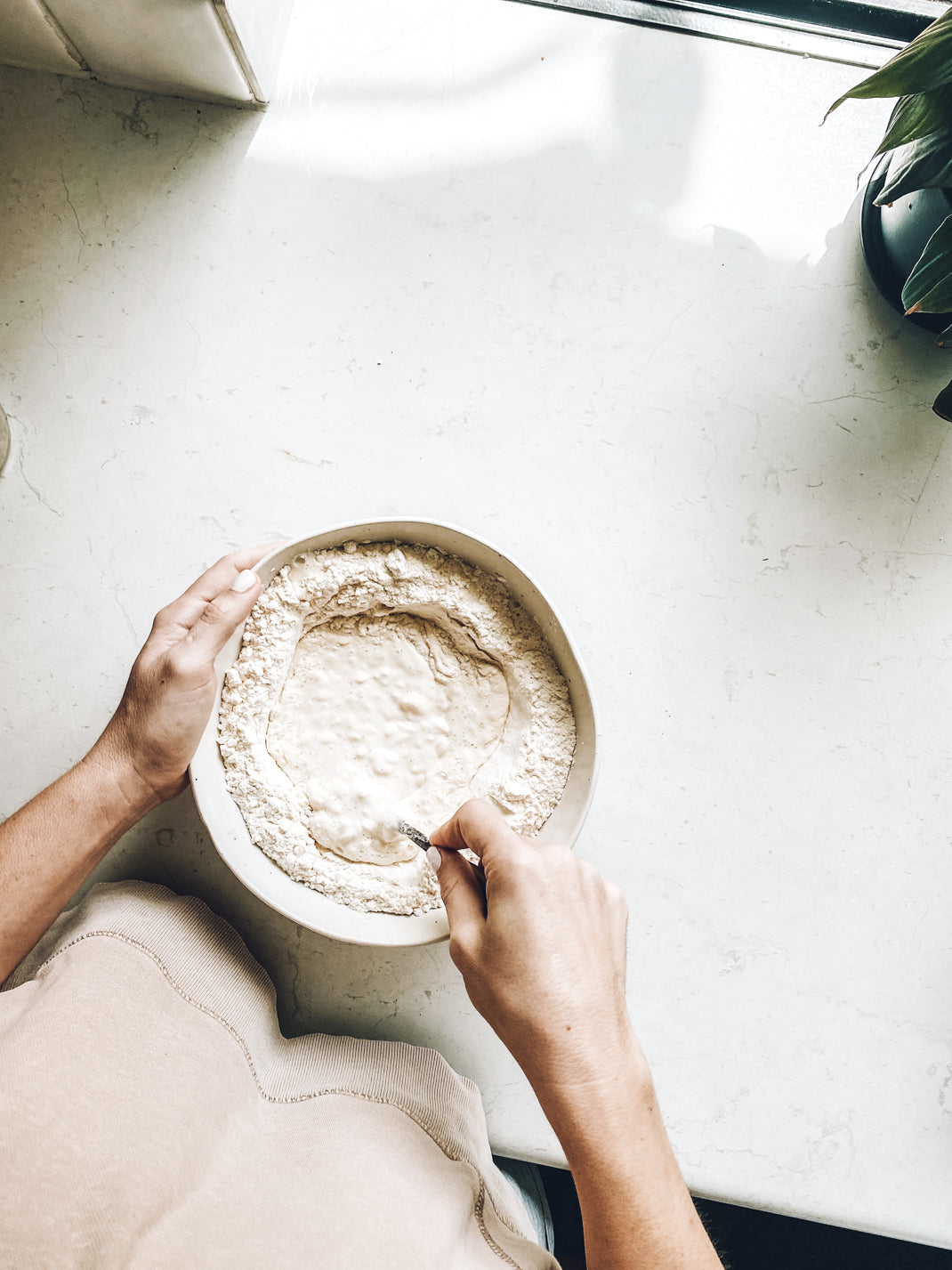 Mixing flour in a our mixing bowl to make scones