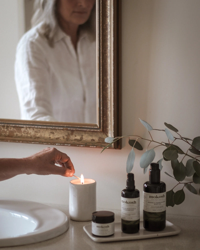 Lighting a candle in the bathroom