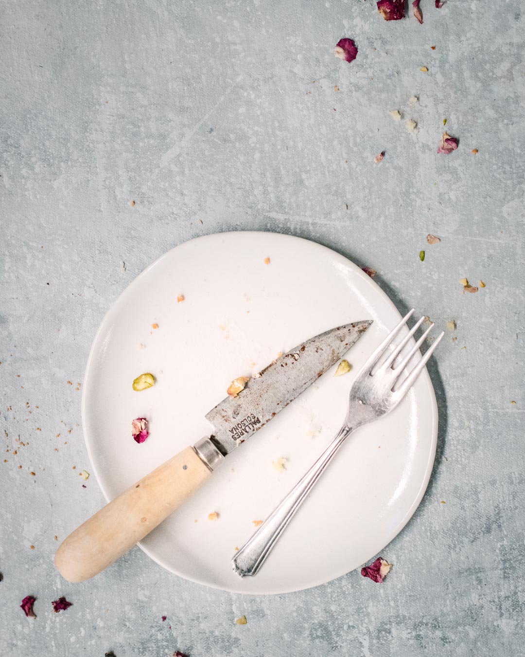 Fika plate surrounded by cake crumbs