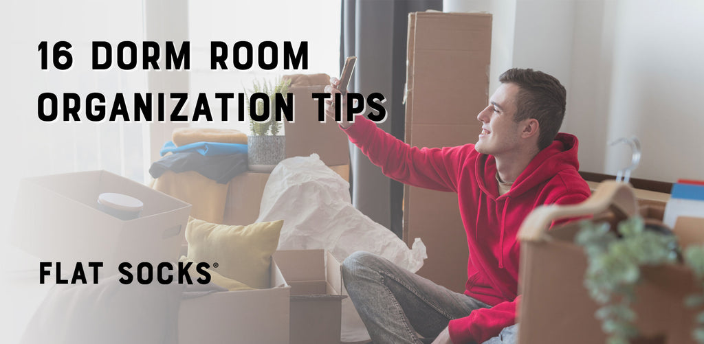 College student in dorm surrounded by boxes