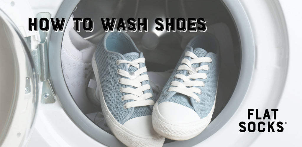 pair of blue canvas shoes in front loading washing machine with door open