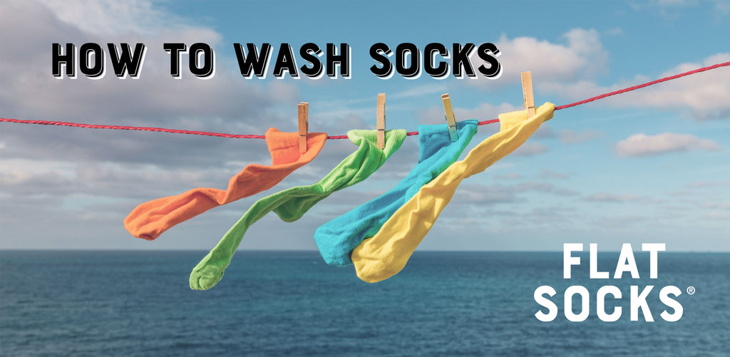 colorful socks on a clothesline in front of an ocean view