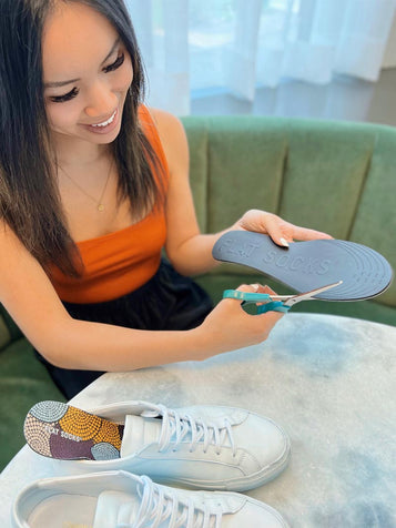 Girl trimming FLAT SOCKS to fit into her shoes