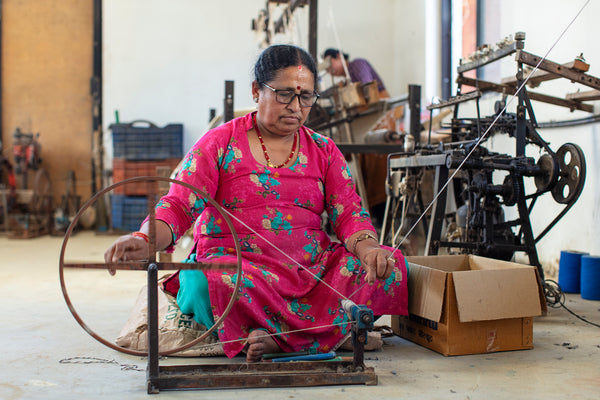 Nepalese artisan handlooming thread for textiles