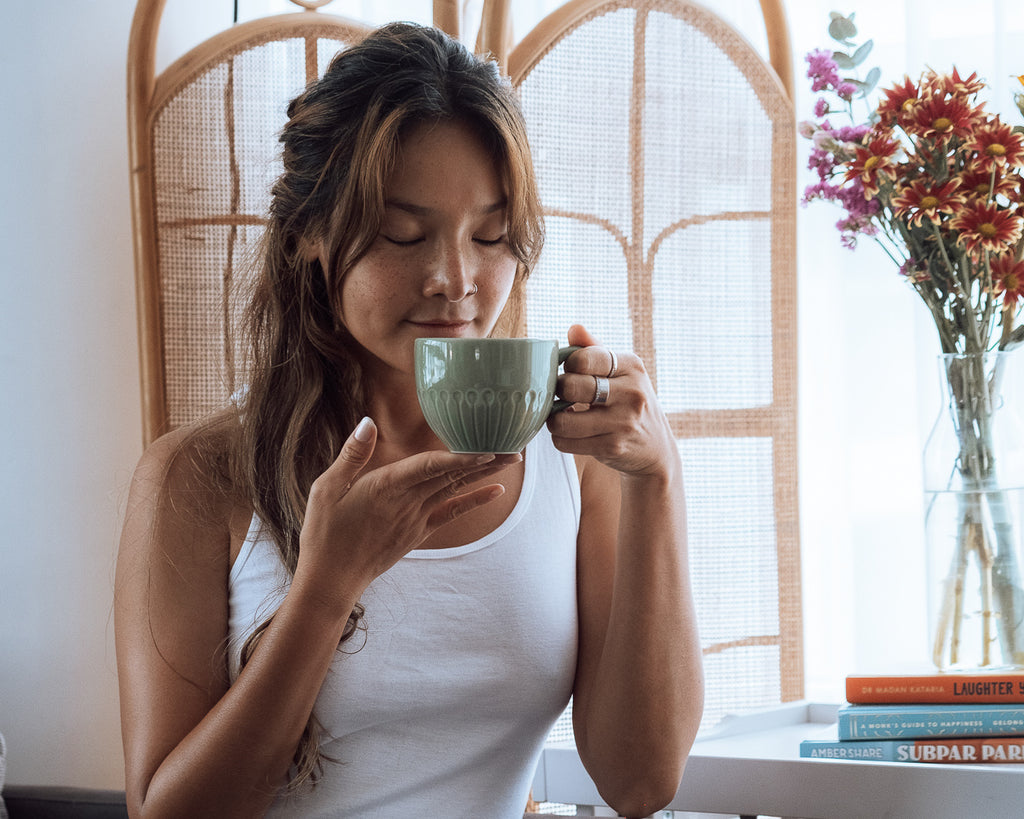 woman drinking moringa tea