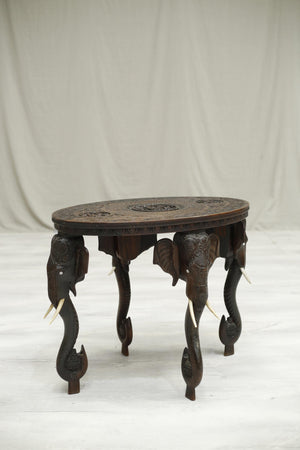 coffee table with elephant head legs