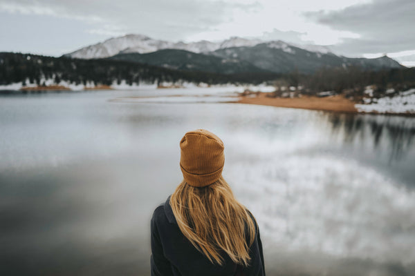woman looking out over a lake during winter time onto a picturesque mountain scene <a style="background-color:black;color:white;text-decoration:none;padding:4px 6px;font-family:-apple-system, BlinkMacSystemFont, &quot;San Francisco&quot;, &quot;Helvetica Neue&quot;, Helvetica, Ubuntu, Roboto, Noto, &quot;Segoe UI&quot;, Arial, sans-serif;font-size:12px;font-weight:bold;line-height:1.2;display:inline-block;border-radius:3px" href="https://unsplash.com/@katiedrazz?utm_medium=referral&amp;utm_campaign=photographer-credit&amp;utm_content=creditBadge" target="_blank" rel="noopener noreferrer" title="Download free do whatever you want high-resolution photos from Katie Drazdauskaite"><span style="display:inline-block;padding:2px 3px"><svg xmlns="http://www.w3.org/2000/svg" style="height:12px;width:auto;position:relative;vertical-align:middle;top:-2px;fill:white" viewBox="0 0 32 32"><title>unsplash-logo</title><path d="M10 9V0h12v9H10zm12 5h10v18H0V14h10v9h12v-9z"></path></svg></span><span style="display:inline-block;padding:2px 3px">Katie Drazdauskaite</span></a>