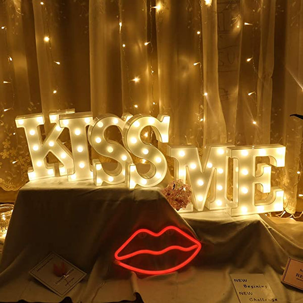 Marquee letters 'KISS ME' lights
