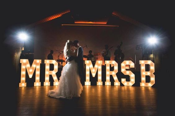 Groom & Bride with the marquee letter lights