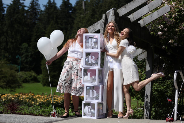 Group photo with a custom letter 'BRIDE' boxes