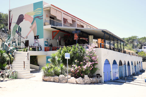 Los Emorandos Hotel in Portinatx, Ibiza. View from the side of the hotel shows the mural of two people kissing