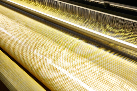 Fabric in the Process of Being Woven on the Weaving Machine