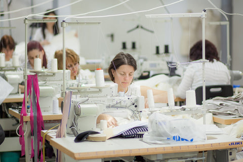 Saywood Blog - Ethical garment manufacturer Mantra machinists sewing the garments on the production line.