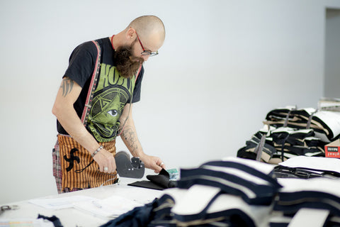Saywood Blog - Mantra garment manufacturer labelling up the size panels for each of the garments.