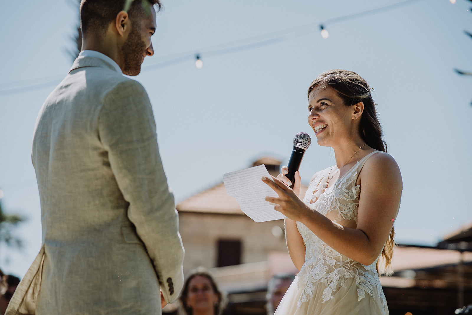 Bride and Groom make their vows in their pre-loved wedding outfits