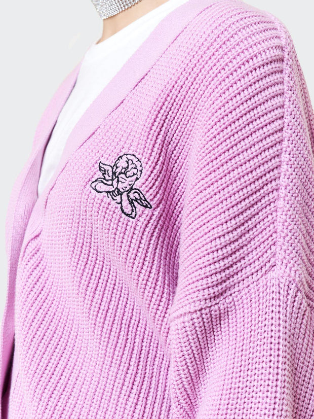 a pink sweater