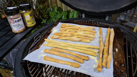 Homemade breadsticks on BBQ with angus and oink seasoning