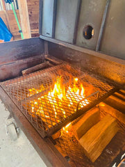 BBQ cooking grates open and on fire for deep cleaning 